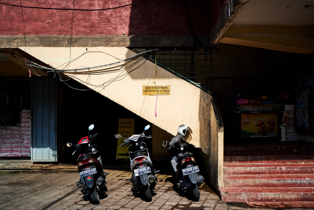 2 men riding motorcycle on road during daytime