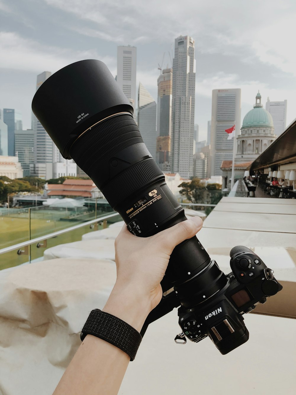 person holding black dslr camera