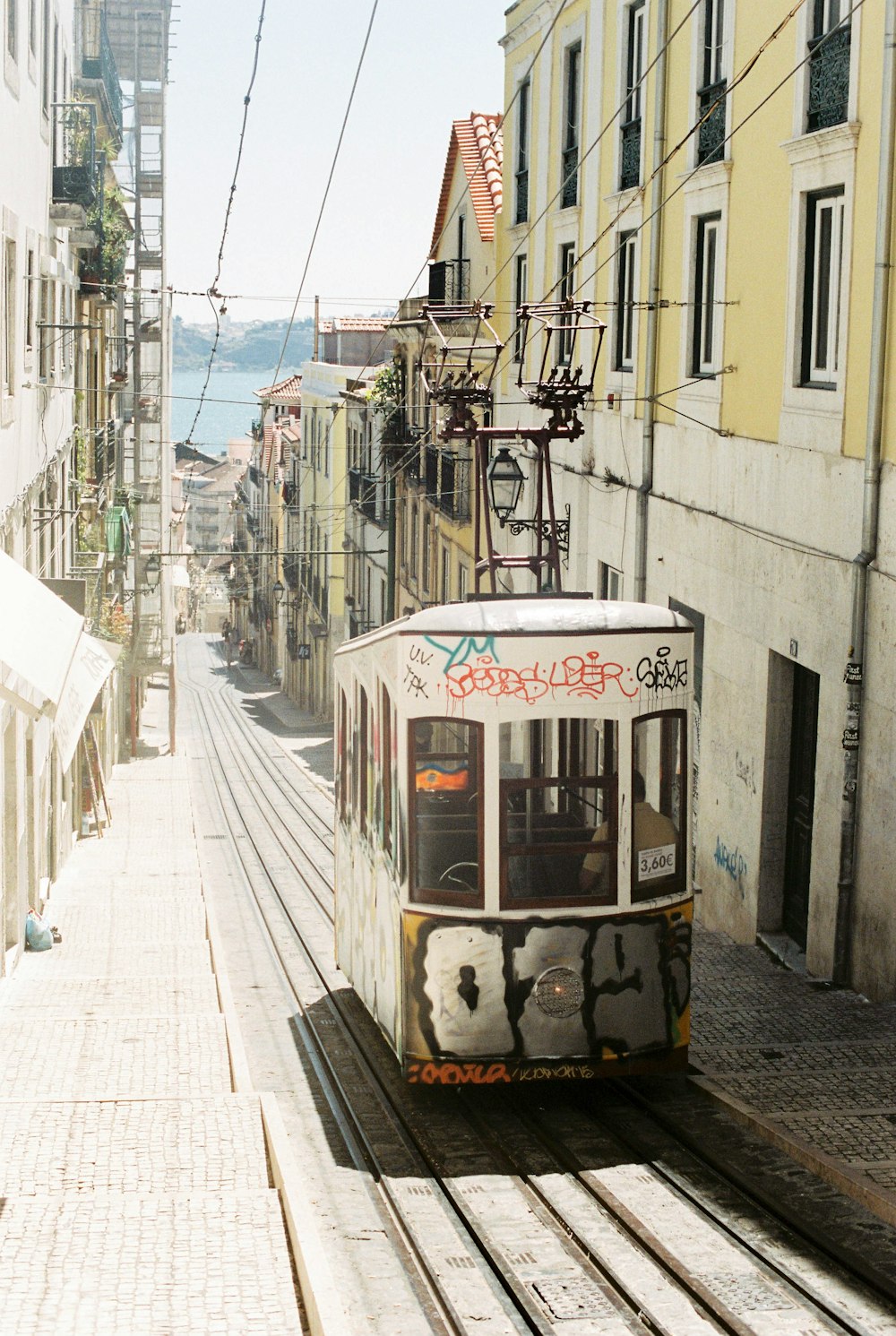 white and brown tram on street during daytime