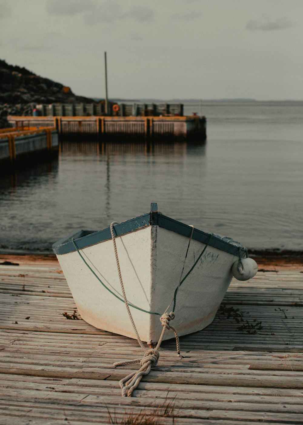 white boat on dock during daytime