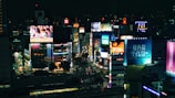 A futuristic cityscape at night with digital ads blending seamlessly into the environment.