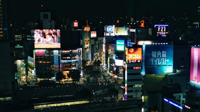 A futuristic cityscape at night with digital ads blending seamlessly into the environment.