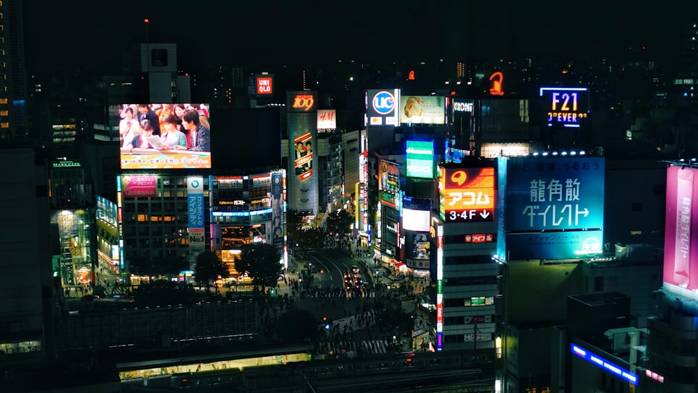 city with high rise buildings during night time