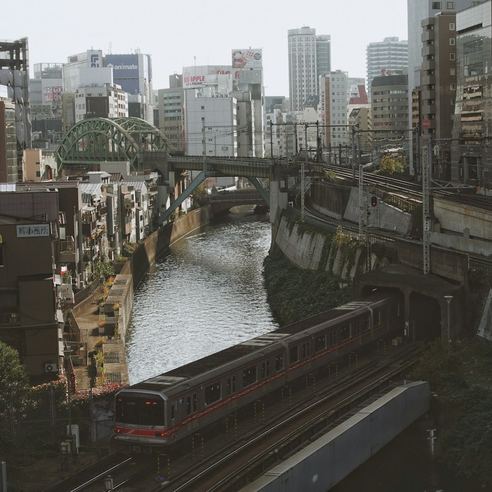 river between buildings during daytime