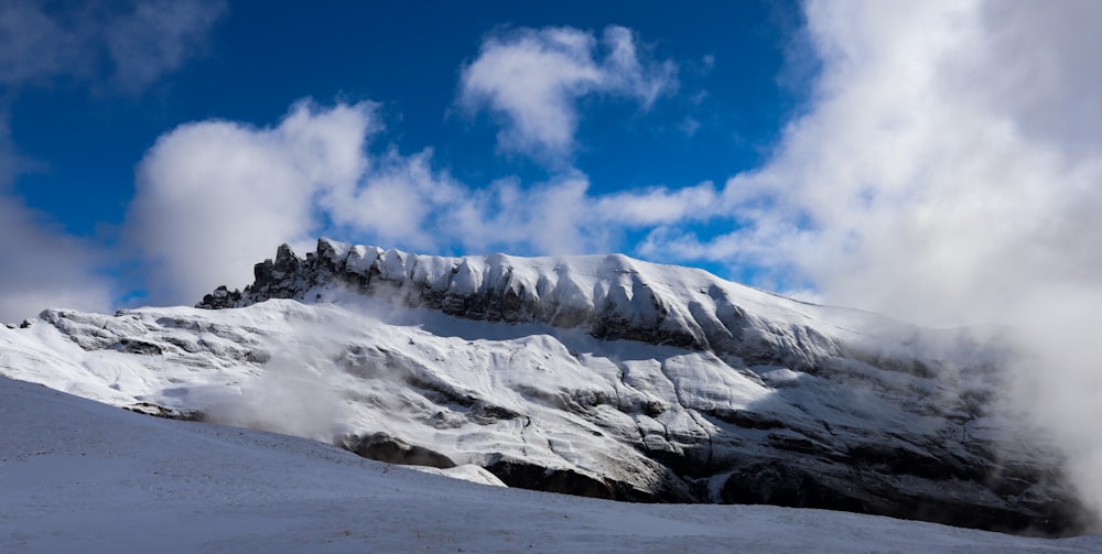 snow covered mountain under blue sky during daytime