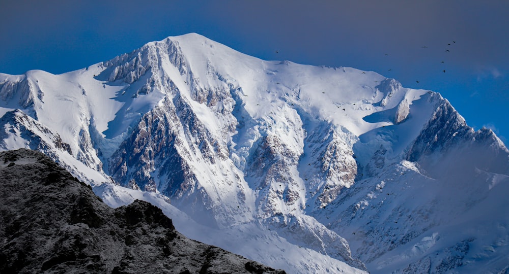 snow covered mountain during daytime