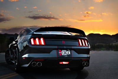 black bmw m 3 on road during sunset