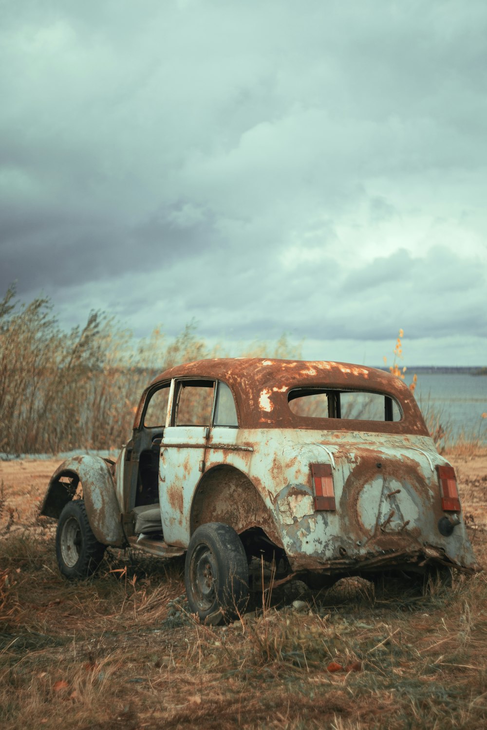 vintage car on brown field during daytime