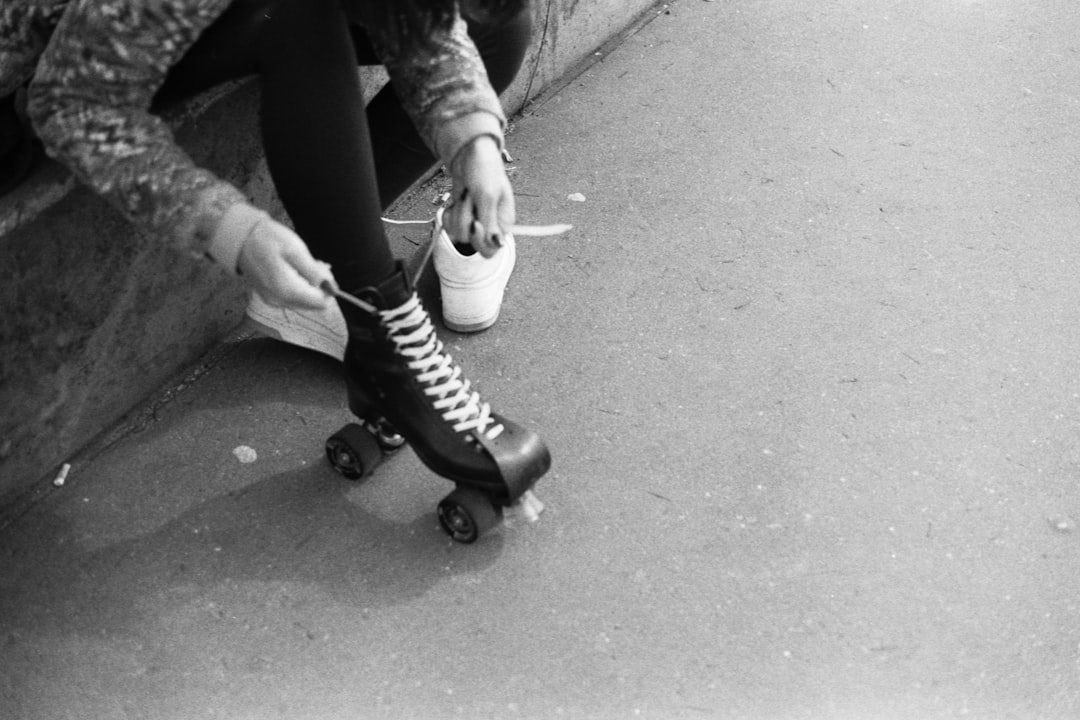 person in black and white sneakers