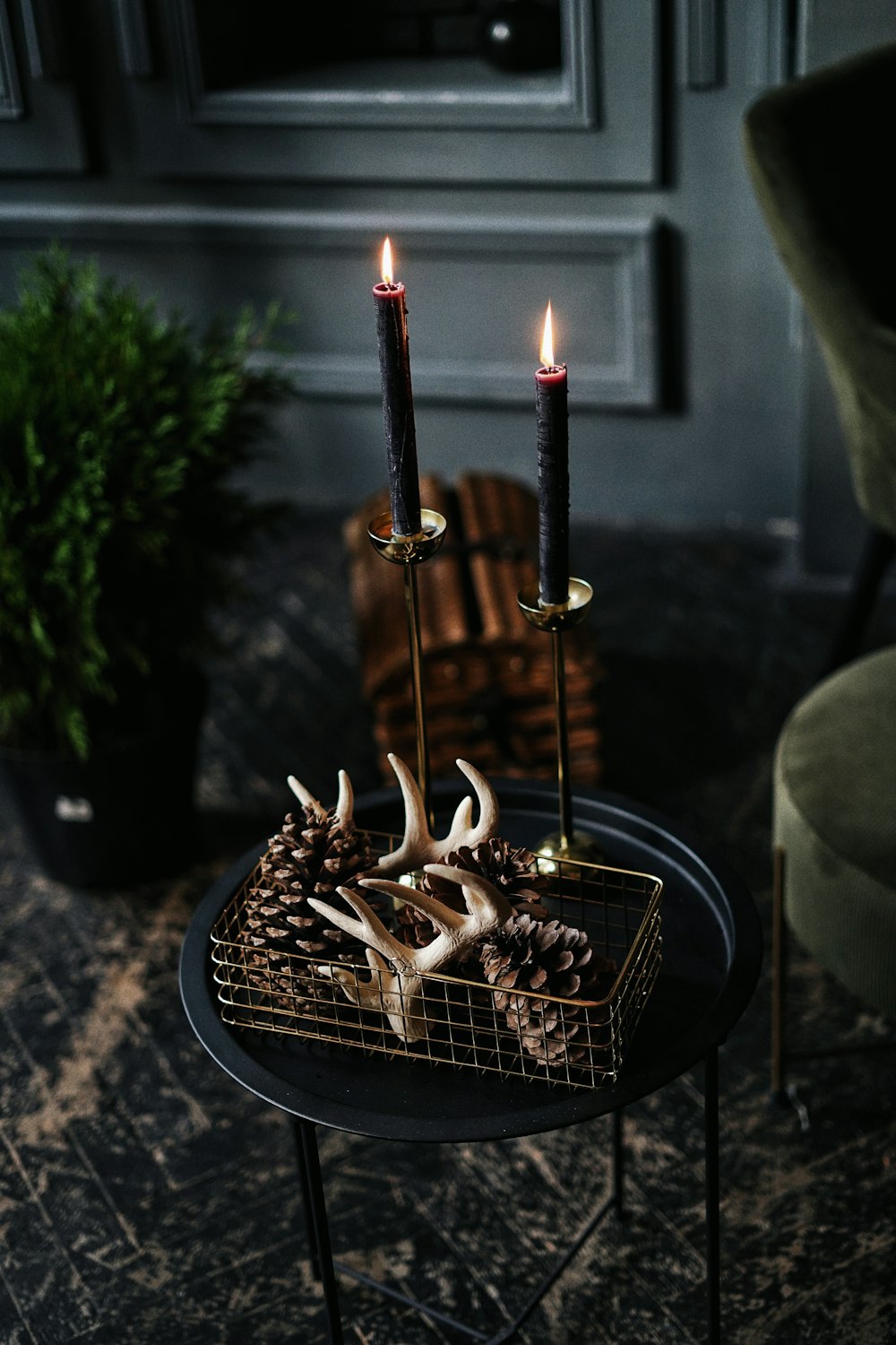 gold steel candle holder with lighted candles