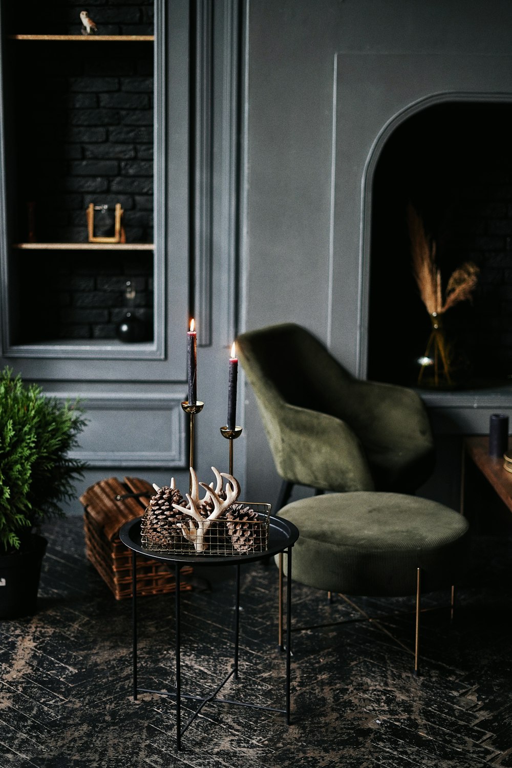 gray padded chair beside brown woven basket