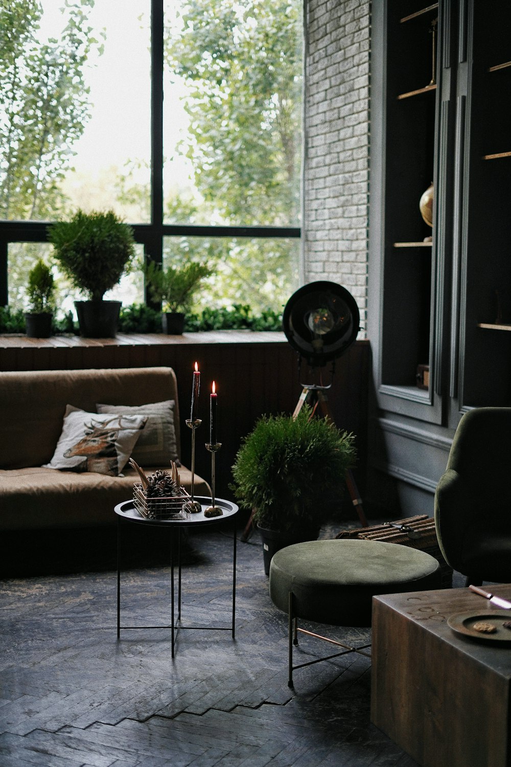 black round table near brown sofa