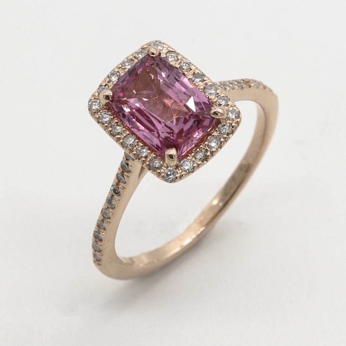 A ring with a pink jewel