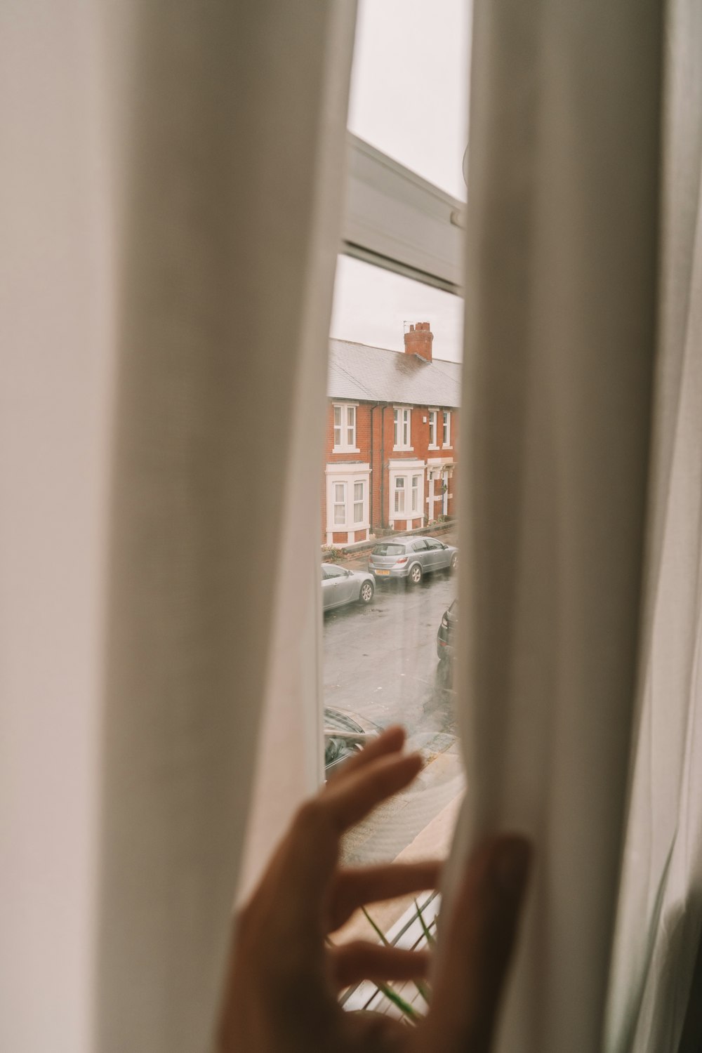 person standing near white wall