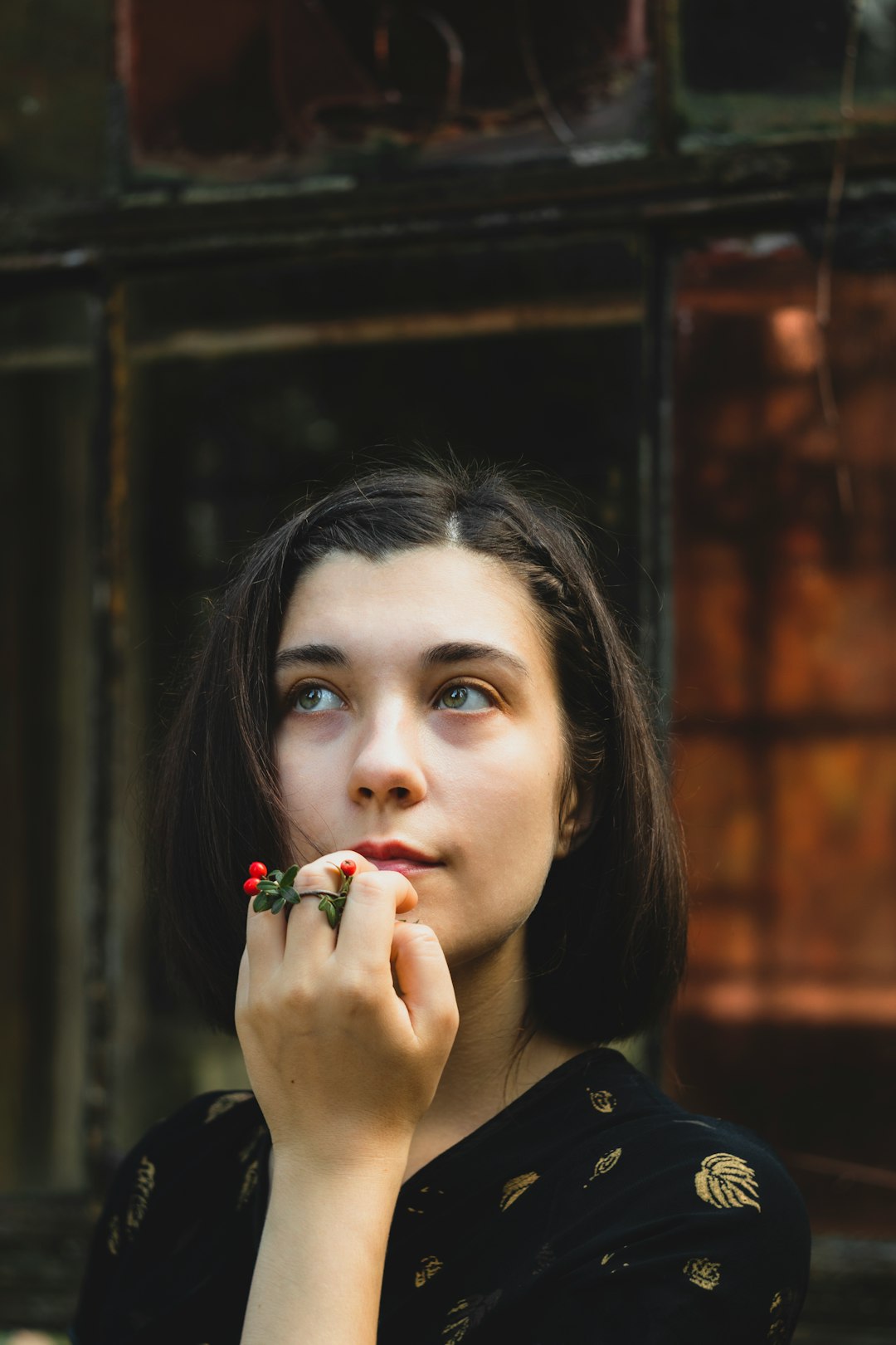 woman in black coat with red lipstick