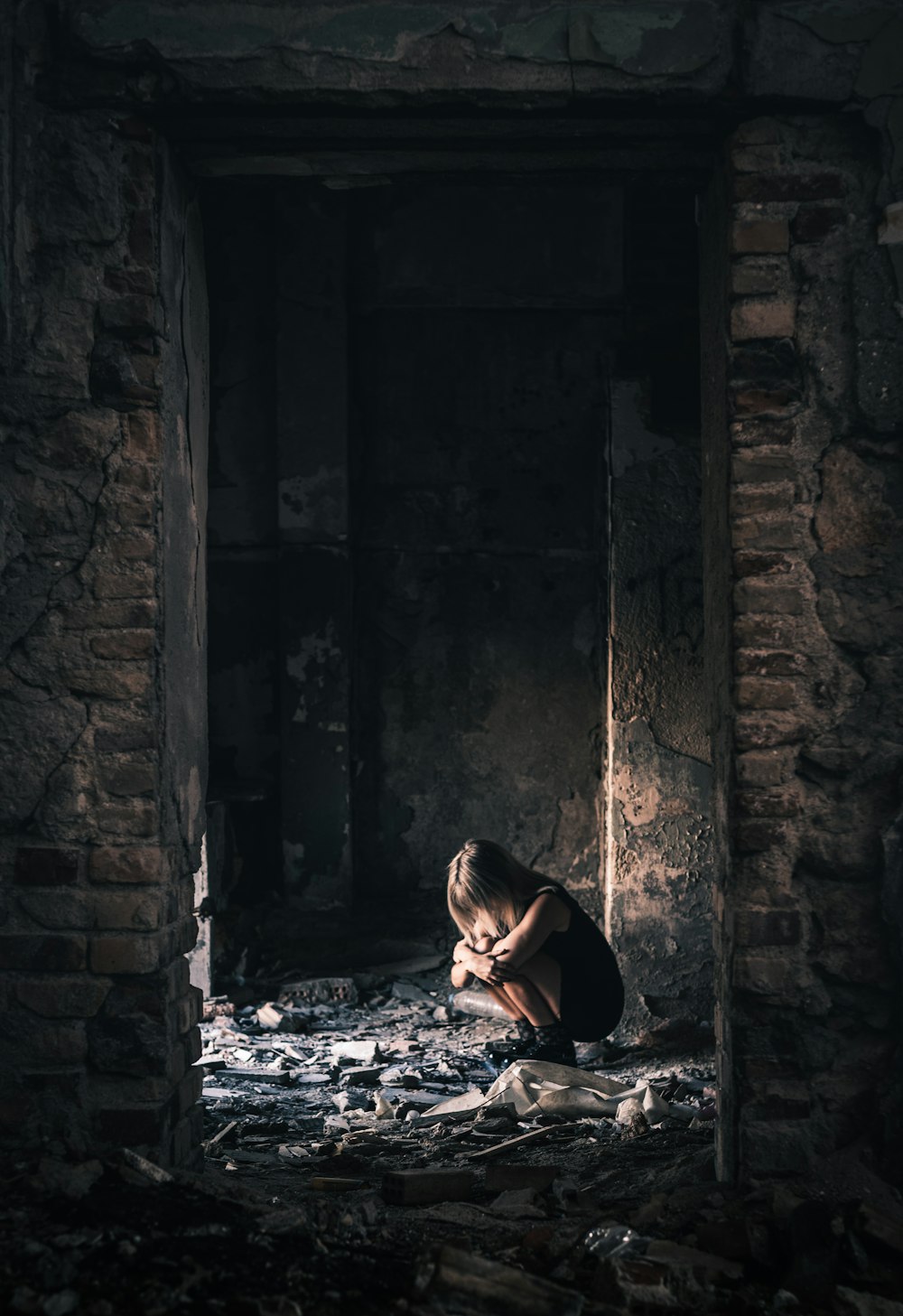 woman in black long sleeve shirt sitting on floor