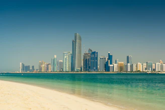 city skyline across the sea during daytime