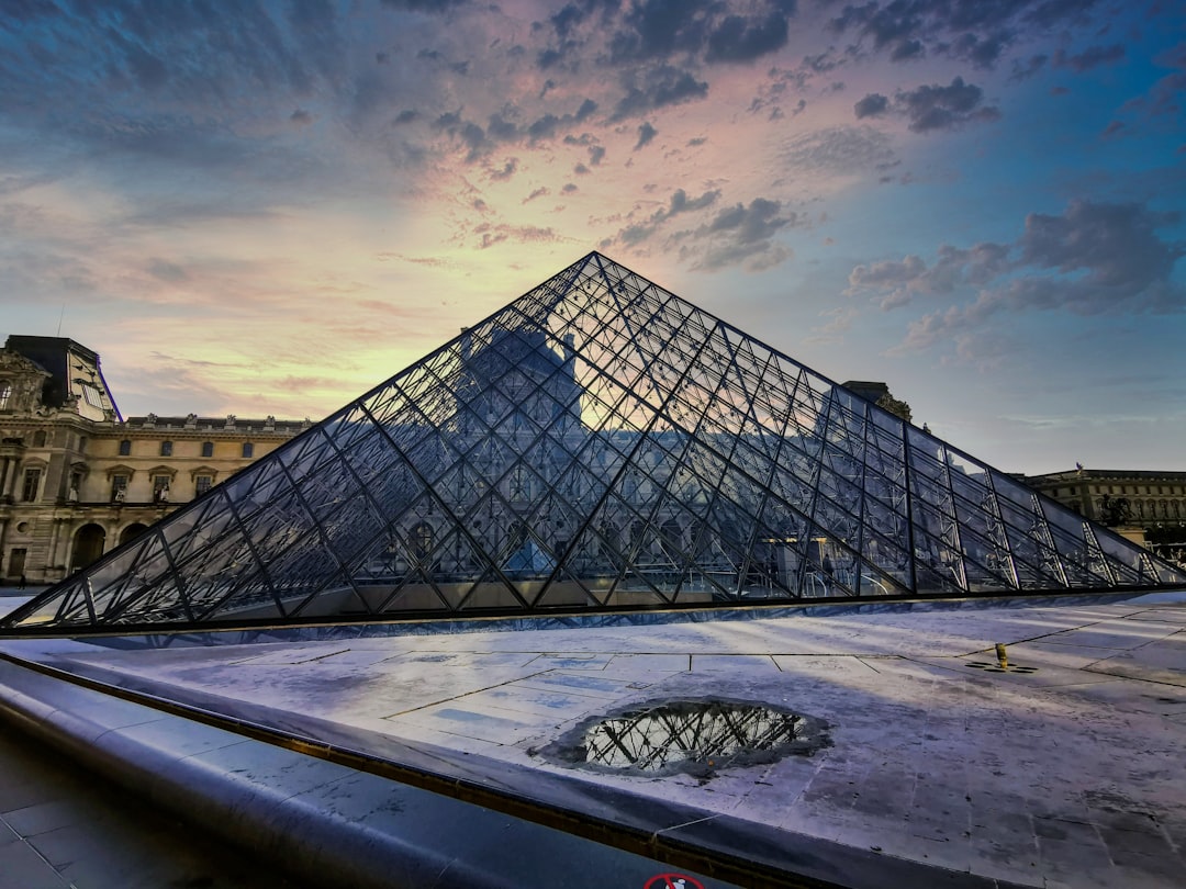 black metal frame glass pyramid building