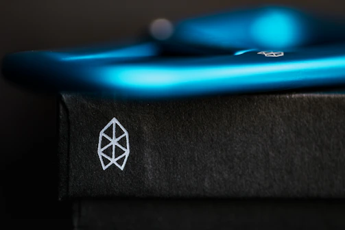 Close-up of a CGI product advertisement with sleek black and blue tones.