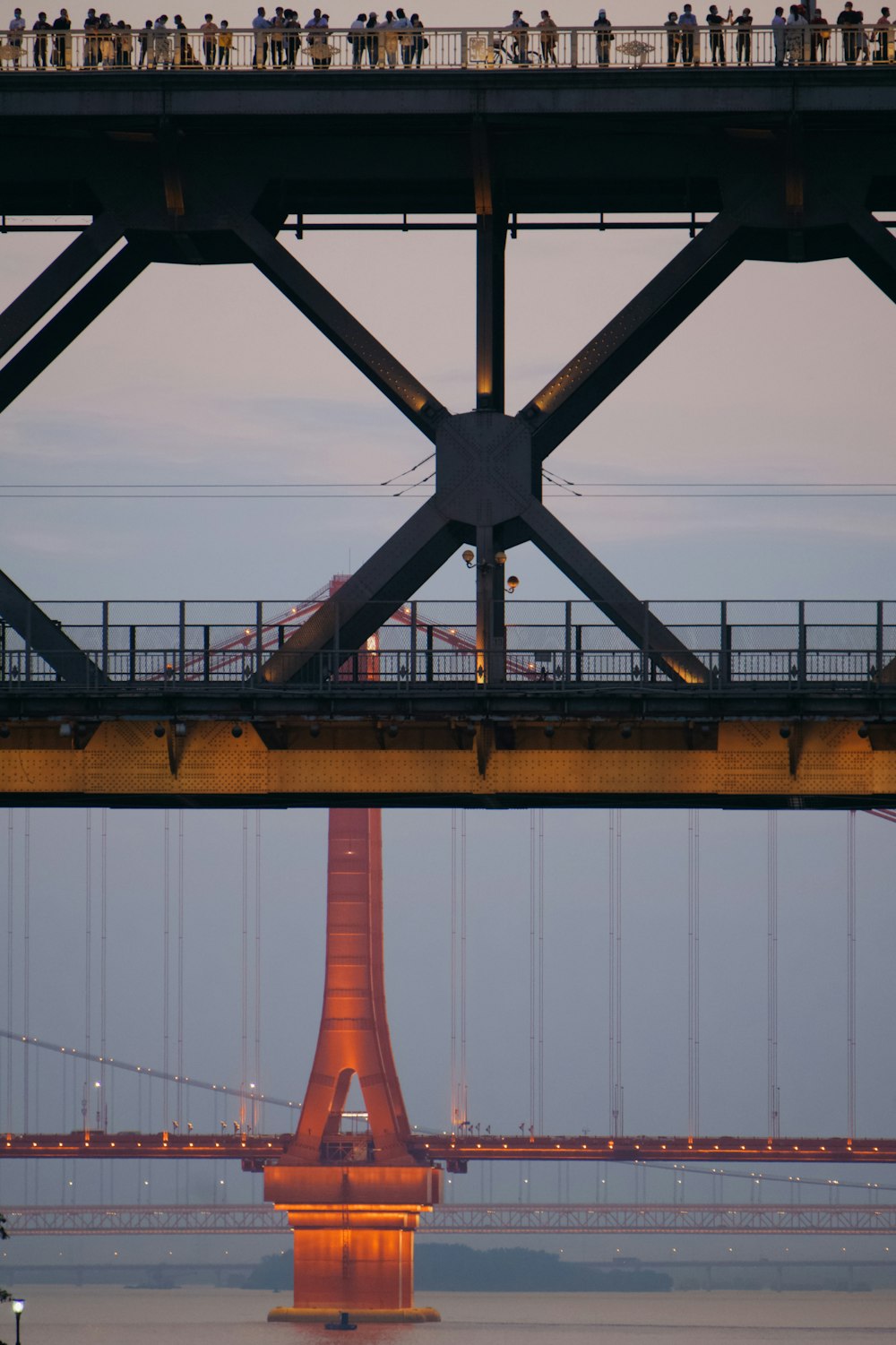 brown metal bridge under blue sky during daytime