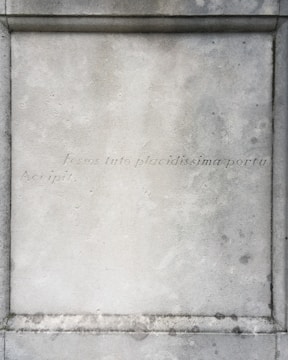 An aged parchment background with faded script and a sepia-toned photo of the temple’s founding ceremony.