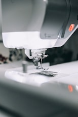 white sewing machine sewing machine