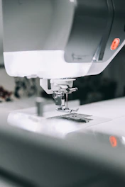 white sewing machine sewing machine
