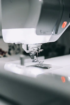 white sewing machine sewing machine