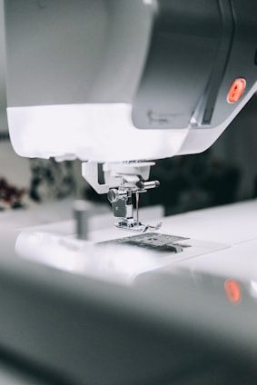 white sewing machine sewing machine