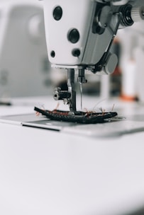 white sewing machine on white table