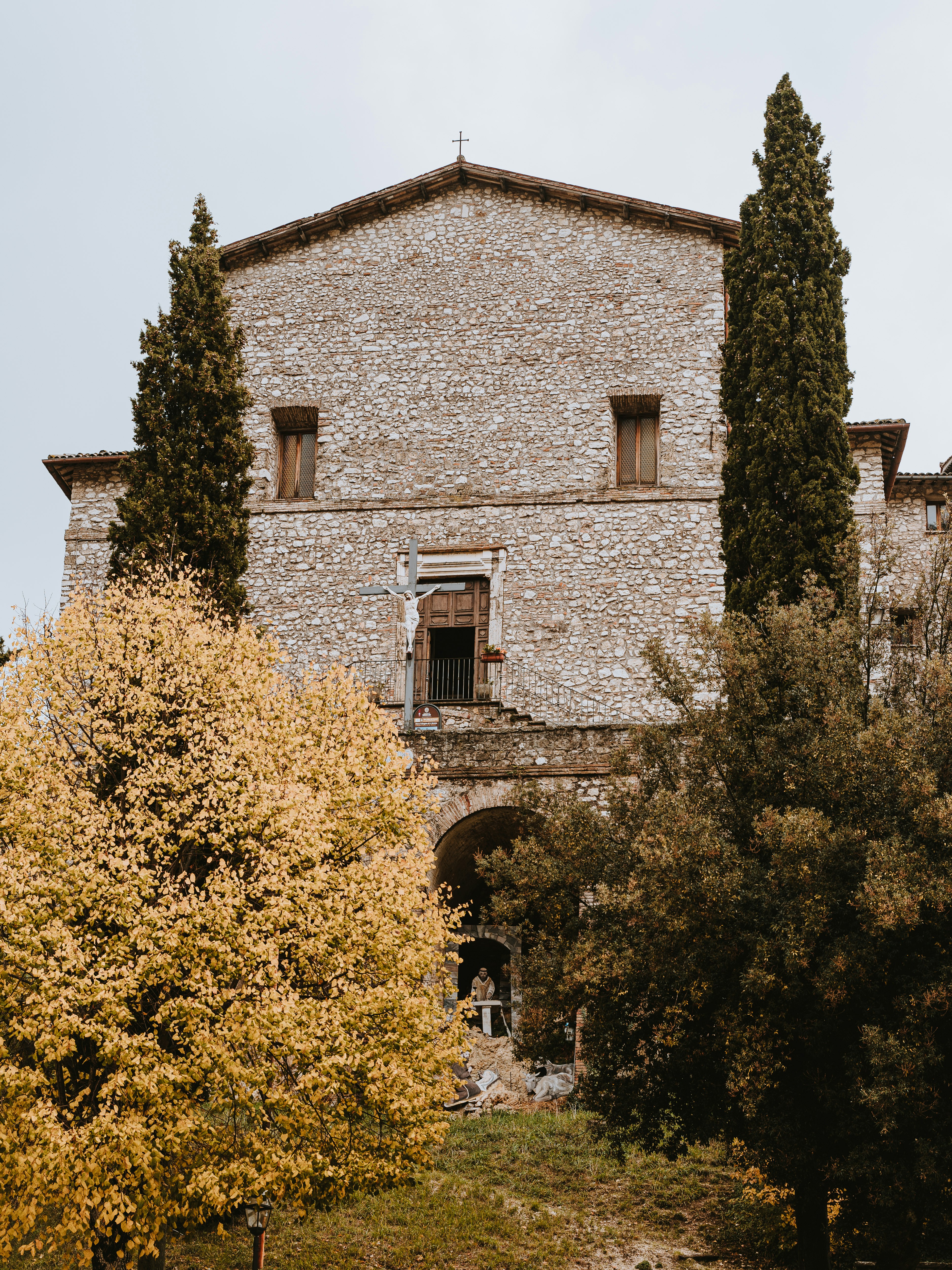 The fourteenth century Catholic church of the Archangel St Michael and bell tower in Greccio, Italy, founded by St Francis of Assisi