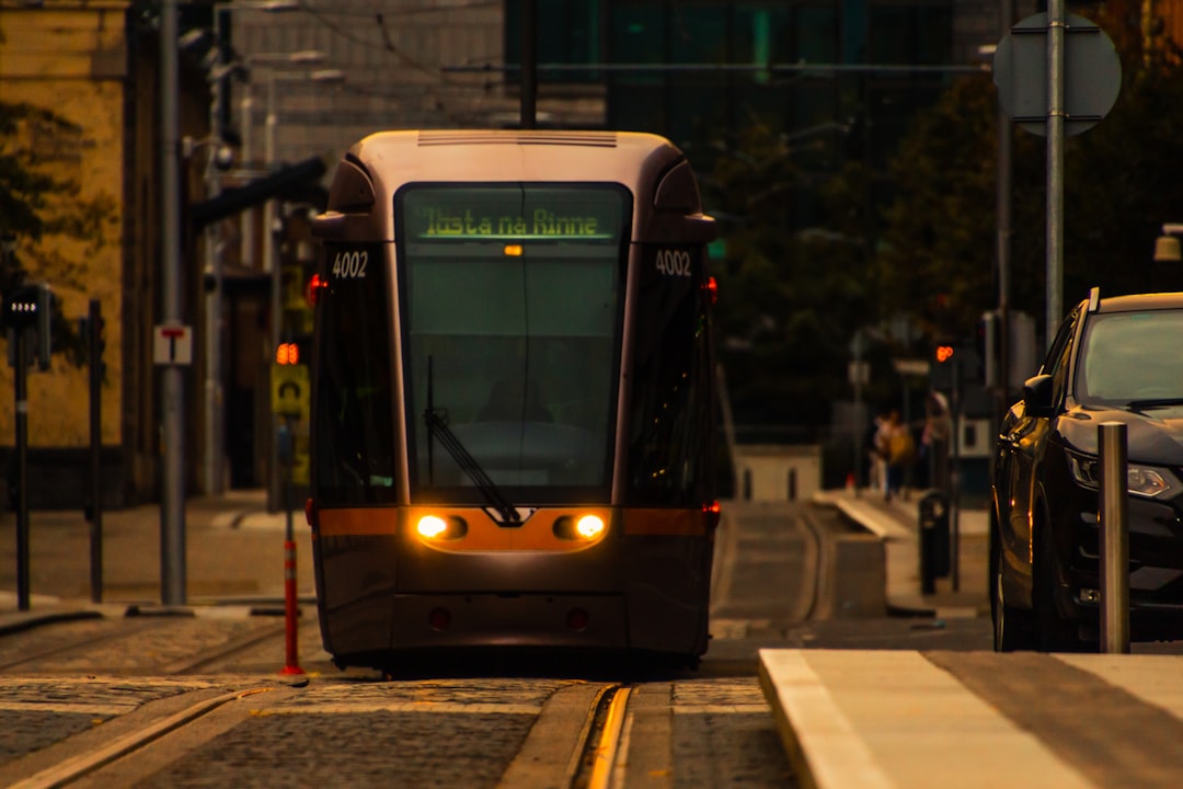 white and black tram on road during night time