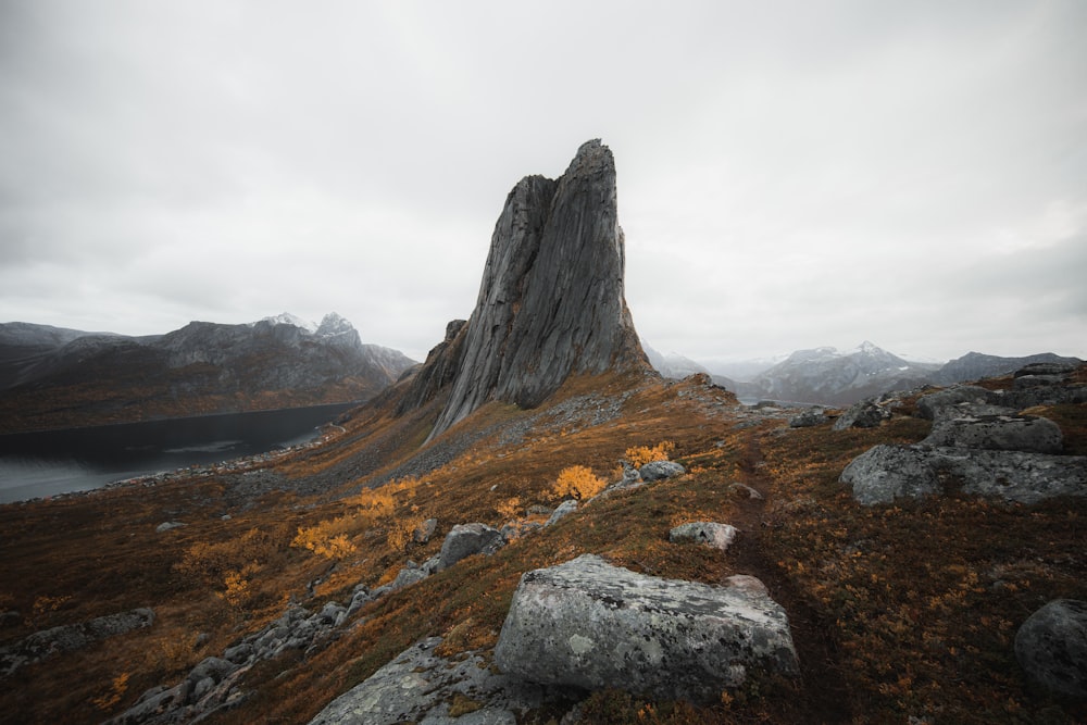 brown and gray rocky mountain under white cloudy sky during daytime