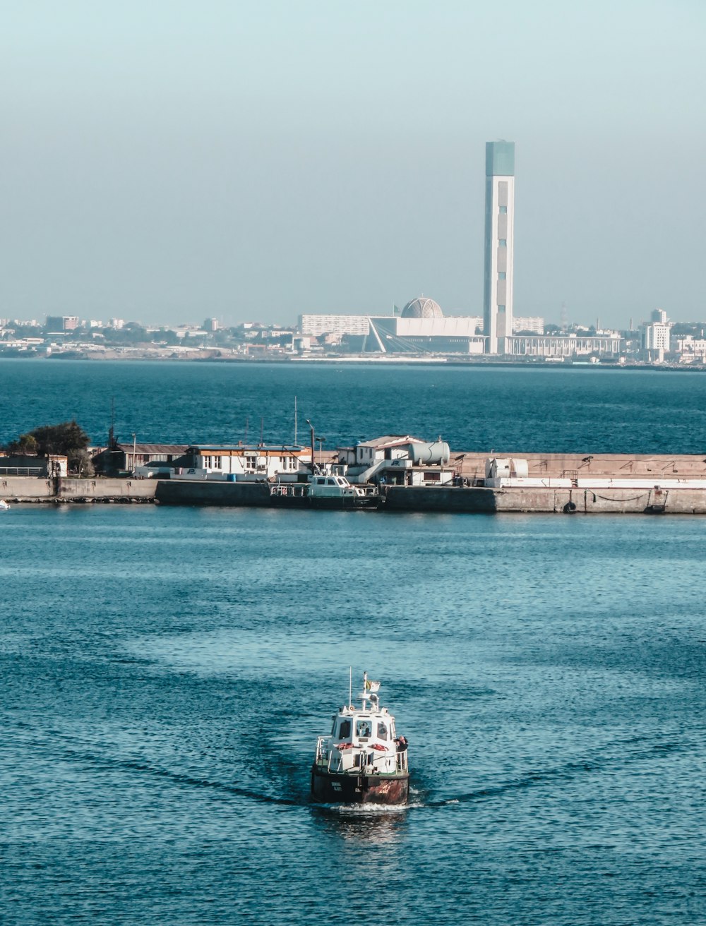 white and black ship on sea during daytime