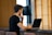 A focused male student working on his laptop, showcasing a happy client.