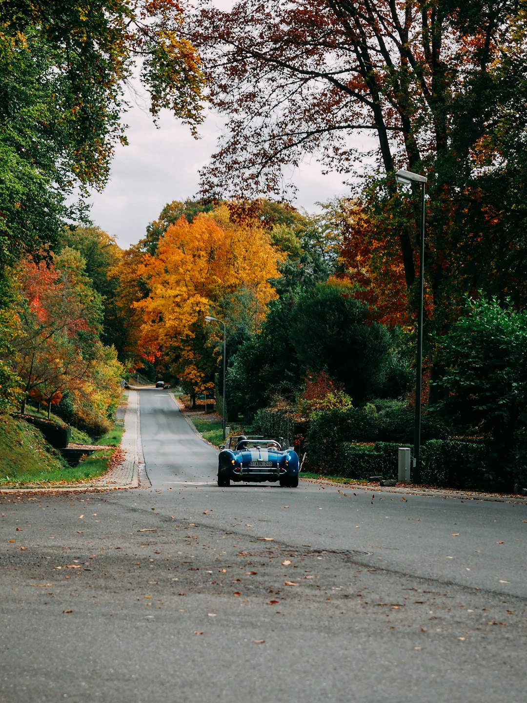 black car on gray asphalt road during daytime