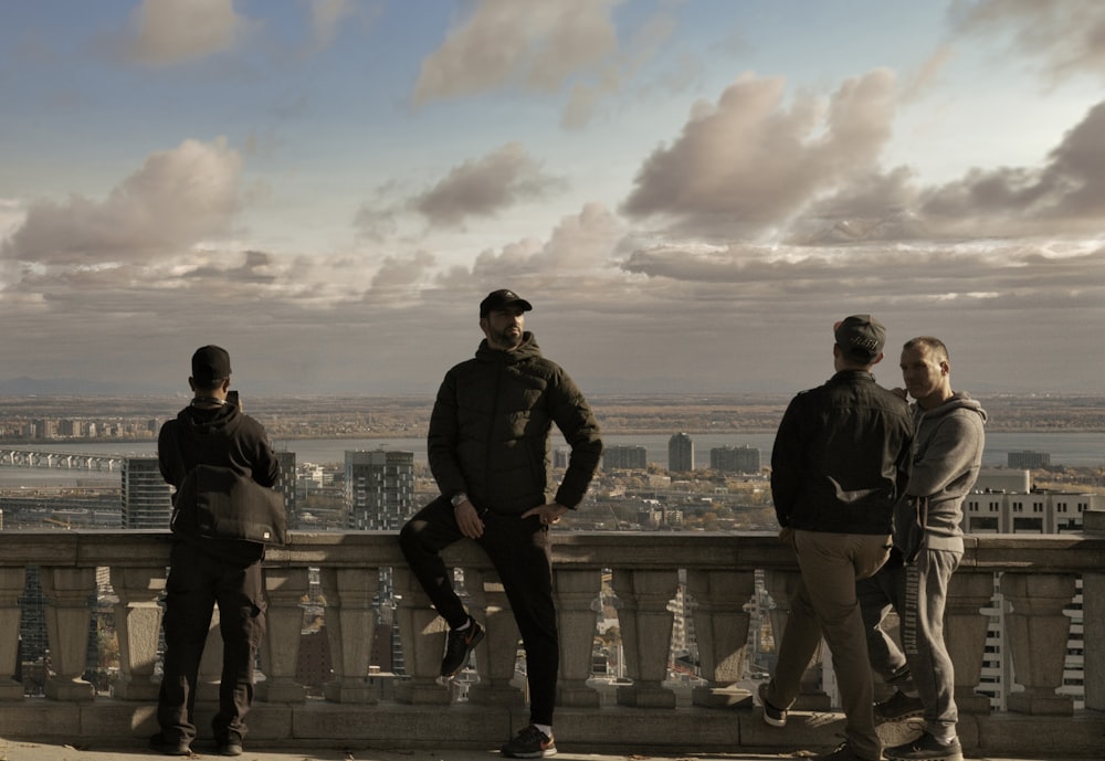 man in black jacket standing beside man in black jacket