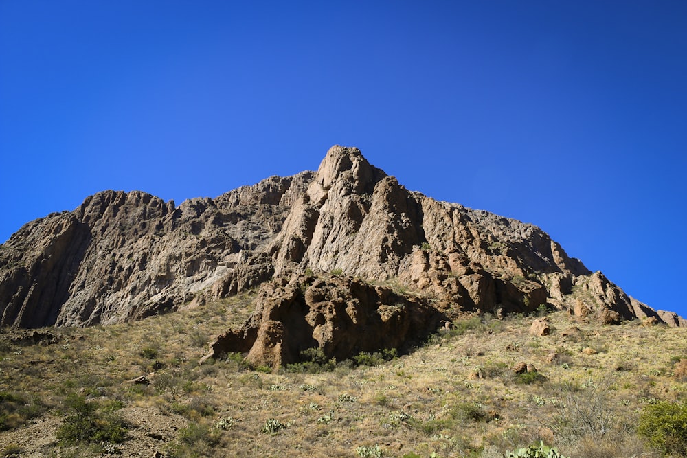 brown rock formation under blue sky during daytime