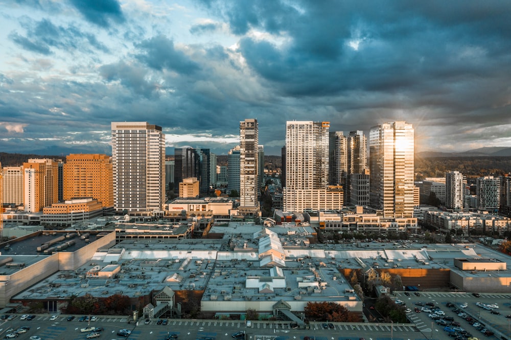 a city with a lot of tall buildings under a cloudy sky