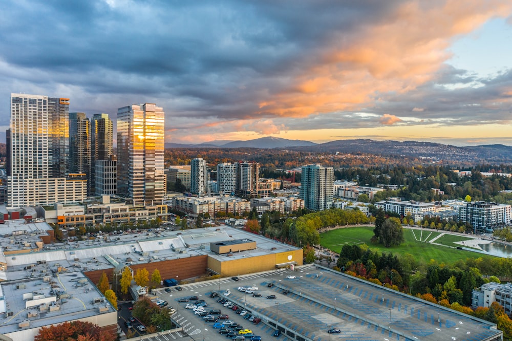 city with high rise buildings under gray sky during daytime