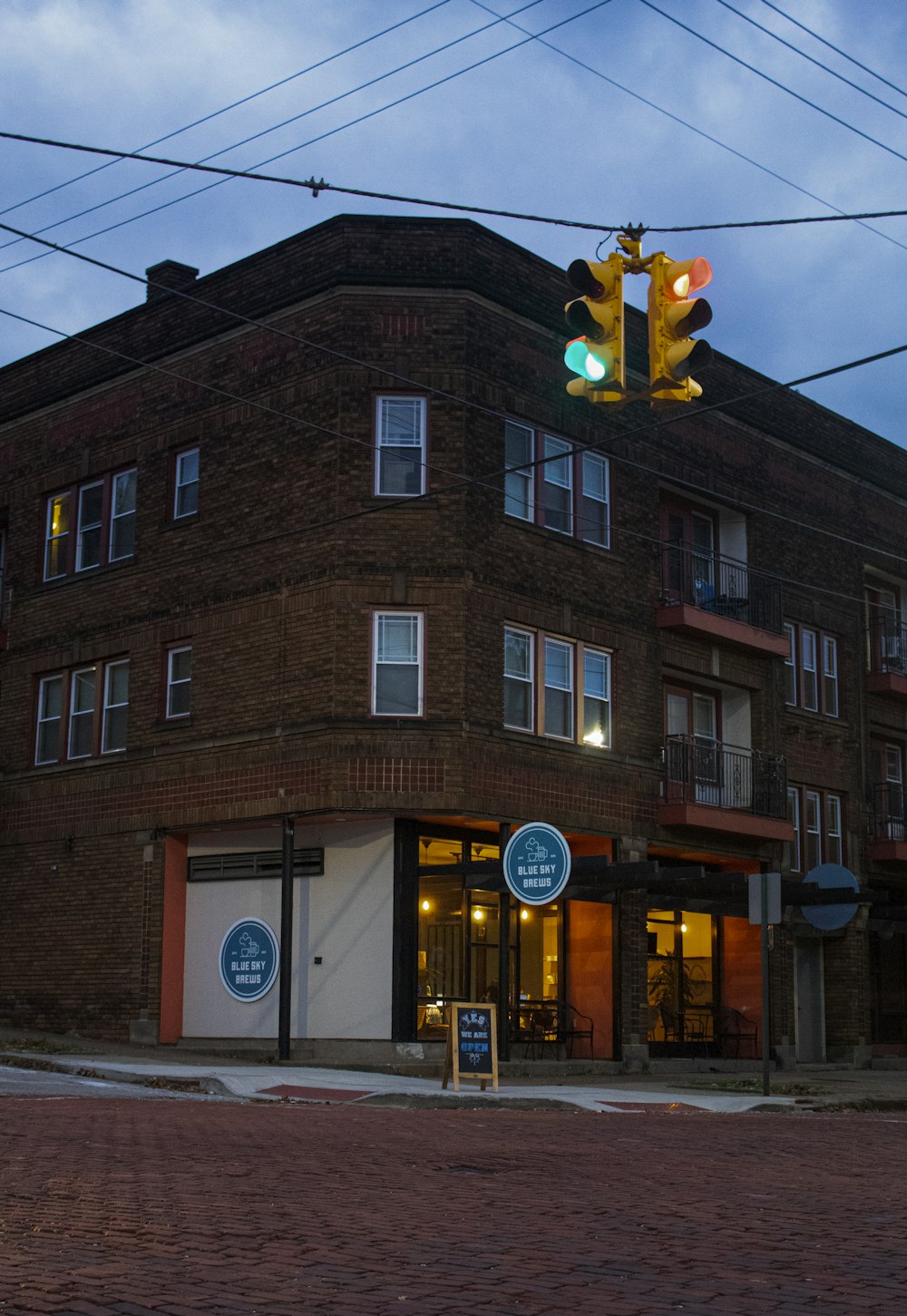 brown concrete building with traffic light