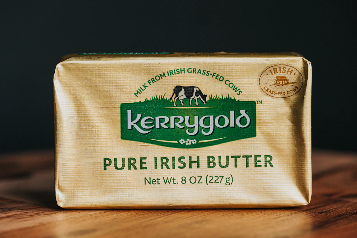 A bar of butter sitting on top of a wooden table
