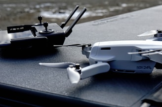 black and gray drone on gray surface