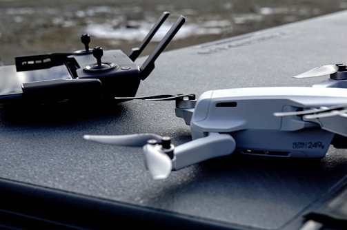 black and gray drone on gray surface