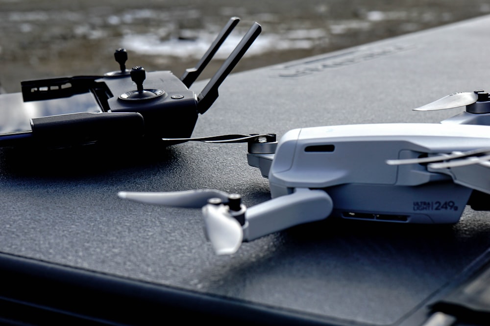 black and gray drone on gray surface