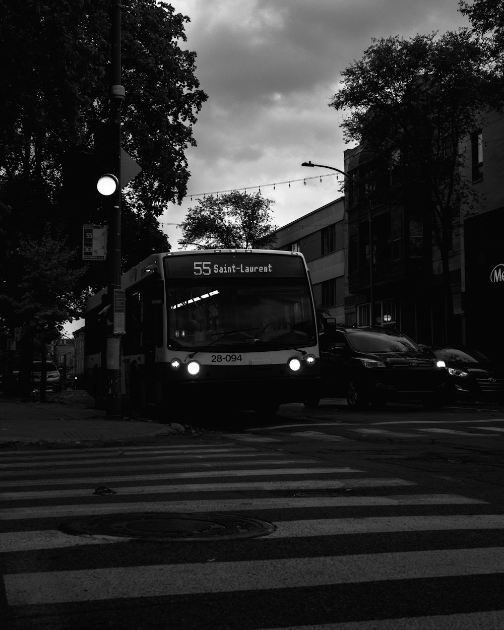 grayscale photo of bus on road