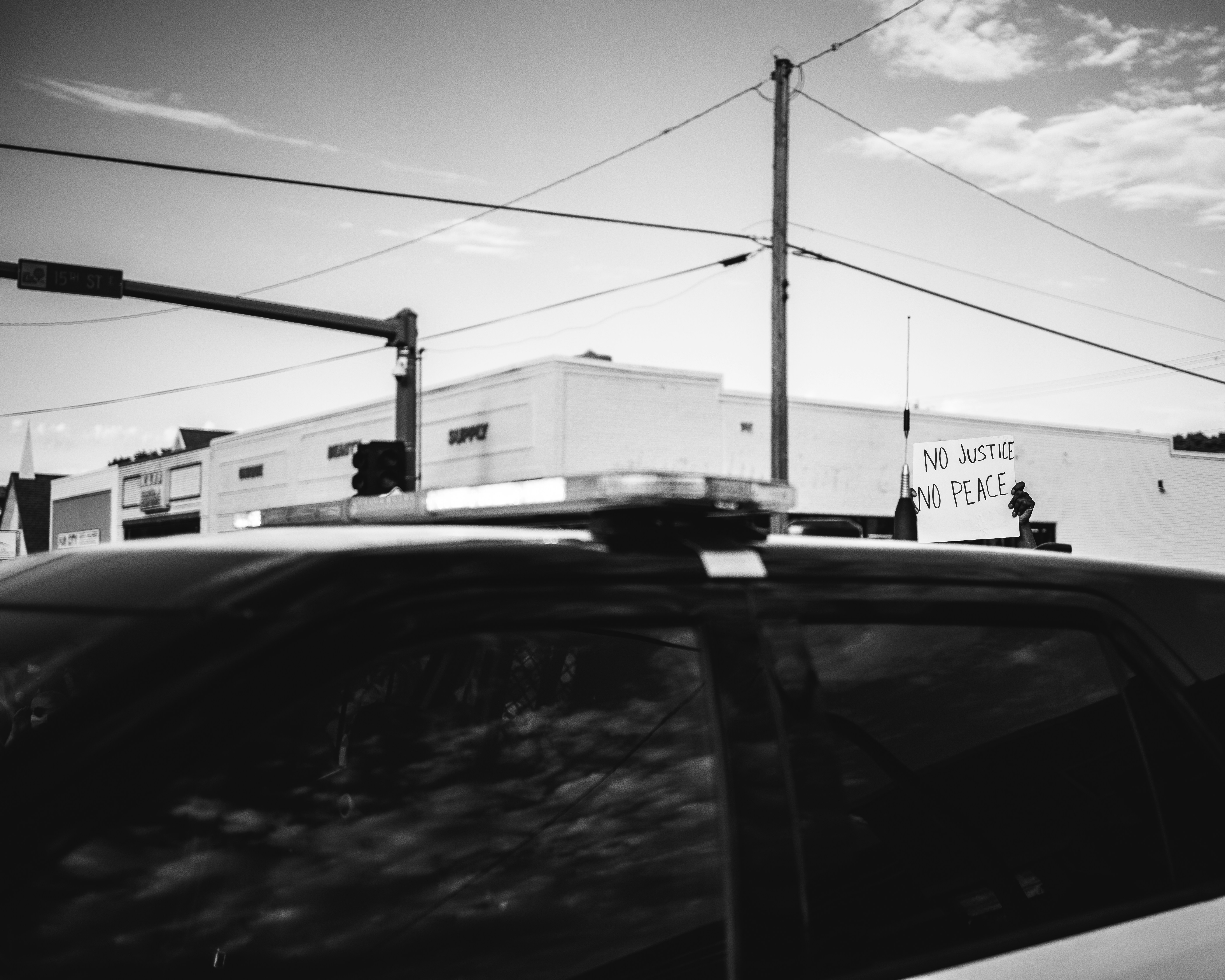 grayscale photo of cars on road