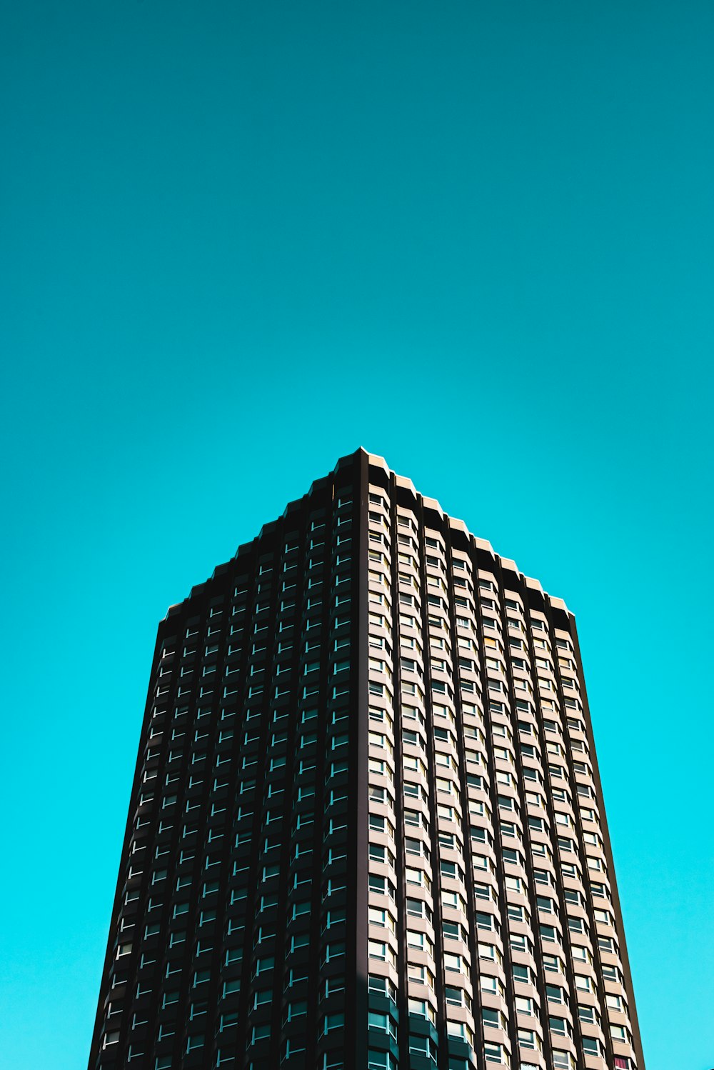 black and gray concrete building under blue sky during daytime