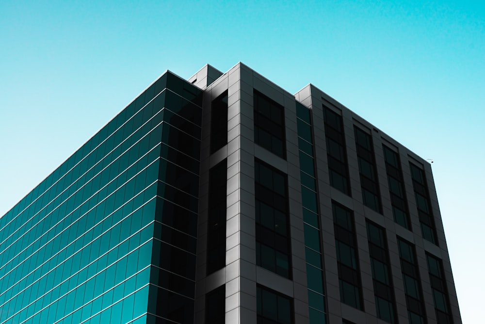 white and green concrete building under blue sky during daytime