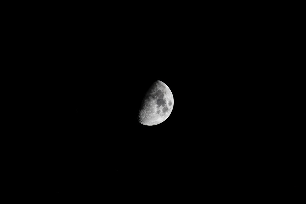 grayscale photo of half moon
